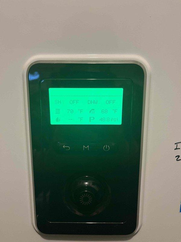 Responded to no hot water complaint involving a system with digital thermostat/controller. Inspected unit displaying "DHW: OFF" status with pressure reading of 48.8 PSI. Verified temperatures at 70°F/68°F and 69°F/63°F at separate control points. Reactivated domestic hot water function and confirmed proper operation before departure.