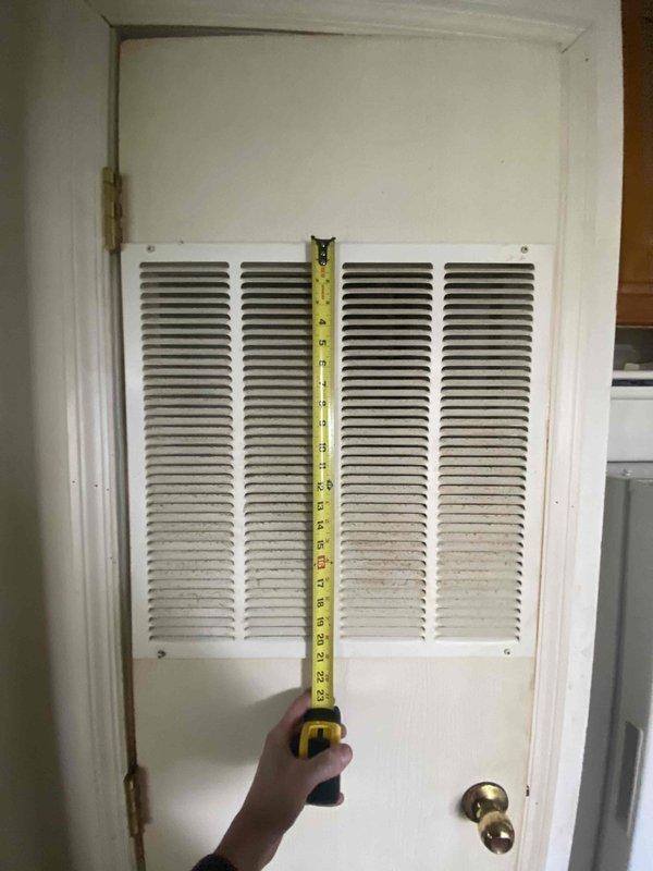 Conducted replacement estimate for 30-year-old electric furnace in manufactured home. Measured existing return air grille (24" height) mounted on interior door and documented external measurements of 160" for proper sizing of new system. Recommended full replacement due to age of unit.