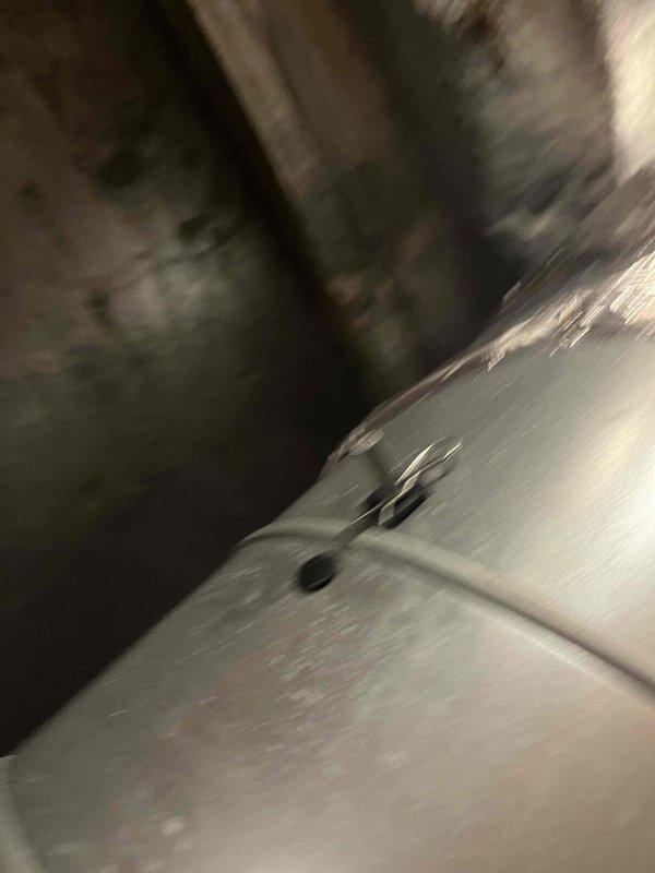 Diagnosed rattling noise in air handler unit; identified source as loose components near barcode area (part #16124). Inspected equipment for warranty eligibility and documented with photographs for service record.