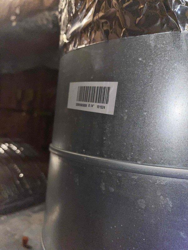Diagnosed rattling noise in air handler unit; identified source as loose components near barcode area (part #16124). Inspected equipment for warranty eligibility and documented with photographs for service record.
