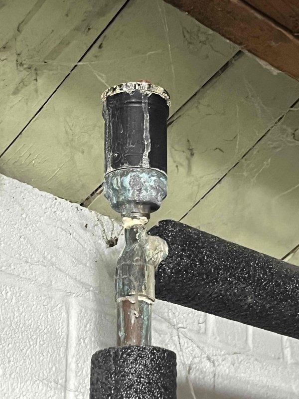Performed routine boiler maintenance visit for club member. Inspected aging hydronic system components, noting corrosion at connection points and mineral deposits on piping. Examined Honeywell expansion tank and associated pressure relief valve, confirming proper operation of the system despite visible wear on brass components.