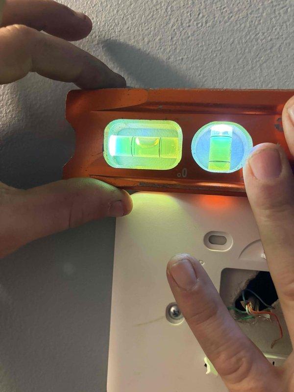 Repaired thermostat for furnace of indeterminate age by verifying proper level installation and checking electrical connections. Inspected furnace unit including vent piping, copper lines, and control mechanisms to ensure proper operation after thermostat service was completed.