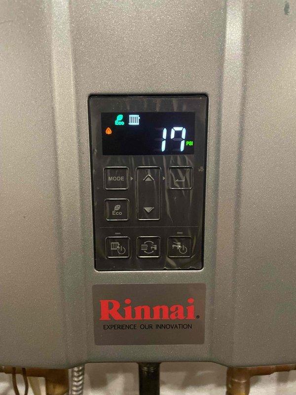 Responded to service call for a 4-year-old Rinnai combi boiler displaying error code "E430" despite system maintaining heating/cooling functionality. Diagnostic assessment revealed pressure irregularities, with display showing 17 PSI. Adjusted system pressure to manufacturer specifications, cleared error code, and verified proper operation of all components including expansion tank and circulation pump. System now operating normally with no error codes present.