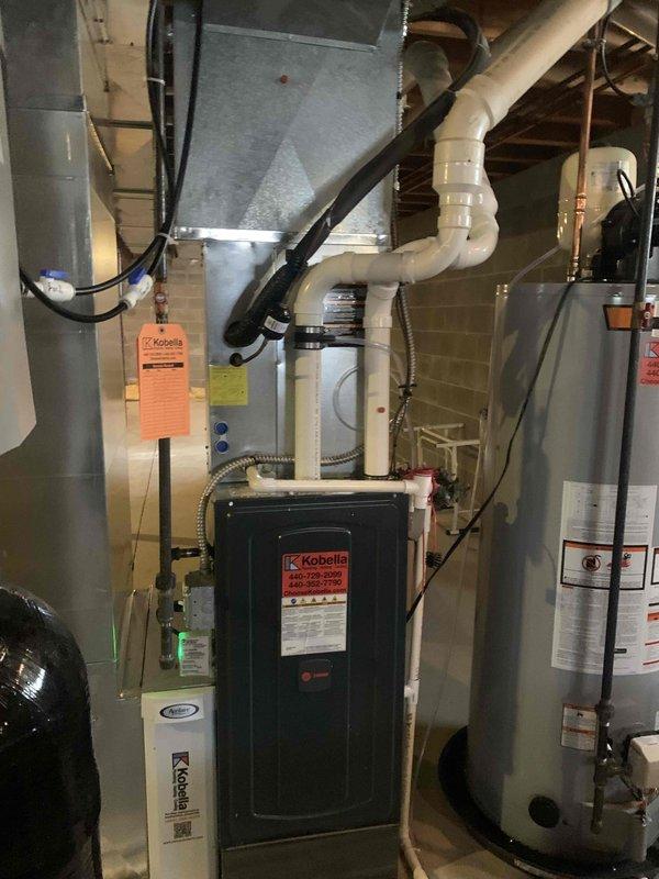Responded to no heat complaint for Kobella furnace system under 10 years old. Customer reported possible gas odor earlier. Upon inspection, found faulty ignition control module causing system failure. Replaced ignition module, verified proper gas valve operation, and tested system through complete heating cycle. All connections were secured and system is now functioning correctly with no gas leaks detected.