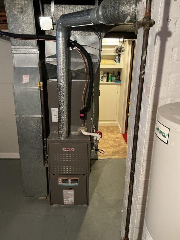 Completed thorough inspection of 40-gallon gas water heater previously sold in December. Unit is a Lochinvar model located in basement utility area next to Lennox HVAC system. Documentation taken of current installation conditions and determined requoting will be necessary before proceeding with replacement.