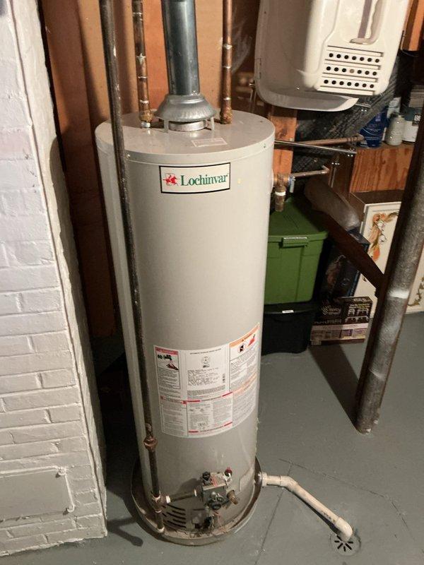 Completed thorough inspection of 40-gallon gas water heater previously sold in December. Unit is a Lochinvar model located in basement utility area next to Lennox HVAC system. Documentation taken of current installation conditions and determined requoting will be necessary before proceeding with replacement.