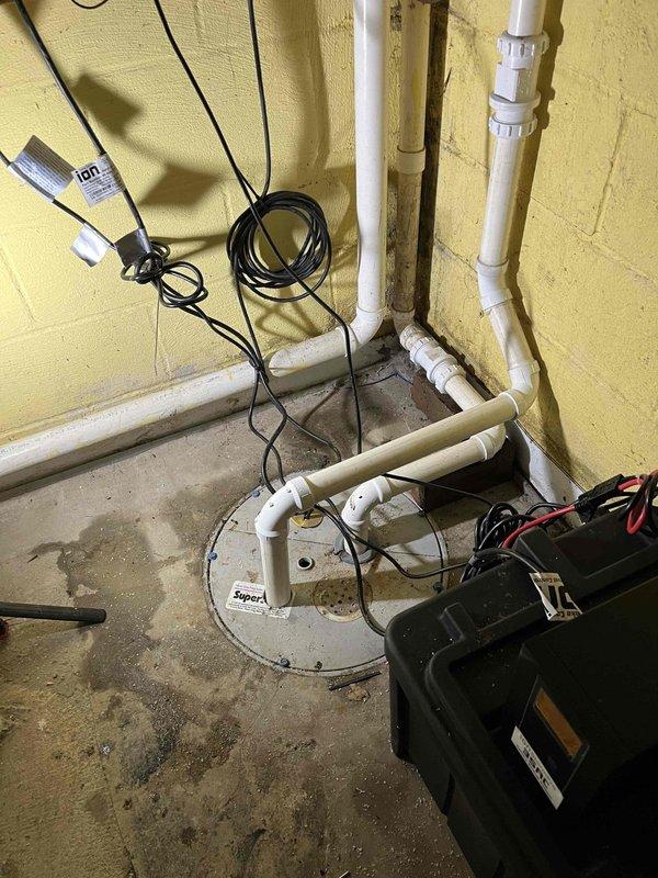 Returned to install a dual battery backup system for the basement sump pump. The system was properly mounted, with all electrical connections secured and tested for functionality. The backup batteries will provide continued operation of the sump pump during power outages to prevent basement flooding.