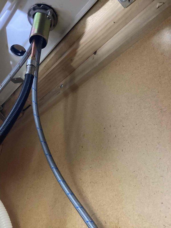 Successfully completed installation of a kitchen faucet replacement (option 2) as sold previously. Installed new chrome single-handle faucet with separate sprayer/soap dispenser on the double-basin composite sink, connecting all required supply lines and ensuring proper function of the new fixture.
