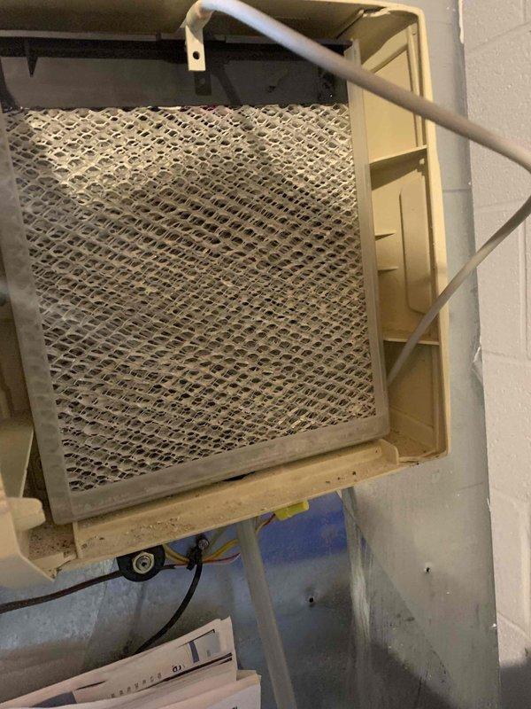 Performed routine tune-up on air handler unit, discovering significantly clogged air filter which was restricting system airflow. Electrical testing with SC480 clamp meter confirmed system drawing 0.52A with normal voltage readings. Recommended regular filter replacement to maintain system efficiency and prevent future airflow issues.