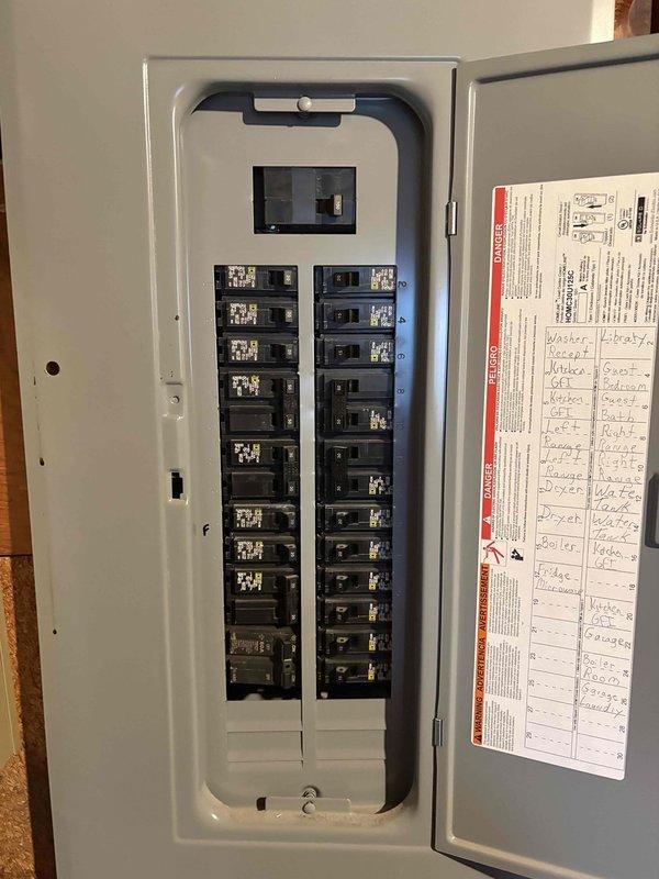 Performed initial site assessment for electric heating conversion project, evaluating customer request to replace existing boiler system with mini-split heat pumps. Inspected and documented electrical service panel (100-amp capacity) to determine compatibility with proposed mini-split installation and potential electrical load requirements.