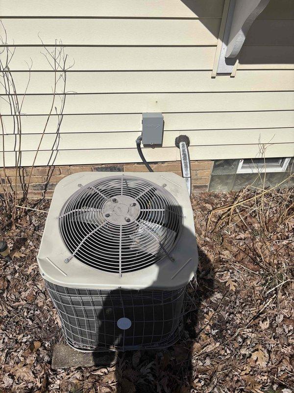Completed inspection of existing dual-zone thermostat system and outdoor AC condensing unit for replacement estimate. Current thermostats show proper functionality with digital displays and WiFi connectivity. Exterior condensing unit exhibits signs of age with surrounding vegetation issues that could impact airflow. Recommended replacement of aging system with compatible equipment to maintain existing zoning capability while improving efficiency.