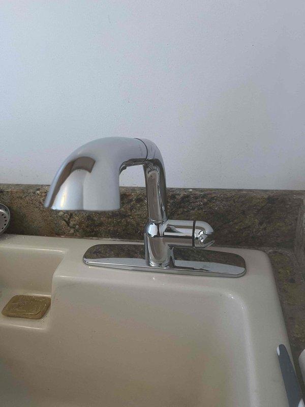 Replaced damaged wax ring on toilet flange to address leak into basement. Inspected newly installed bathroom faucet that was also contributing to the leak issue. Documented repair with photos of both the new faucet installation and the toilet flange with replacement wax ring.