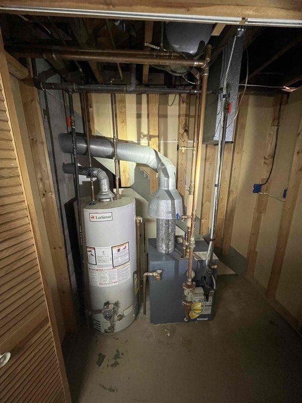 Conducted comprehensive evaluation of existing Lochinvar water heater system and adjacent furnace unit in unfinished mechanical room. Documented current installation configuration, including copper piping network, gas lines, and ventilation components. Assessment completed for potential boiler replacement or system upgrade based on referral request.