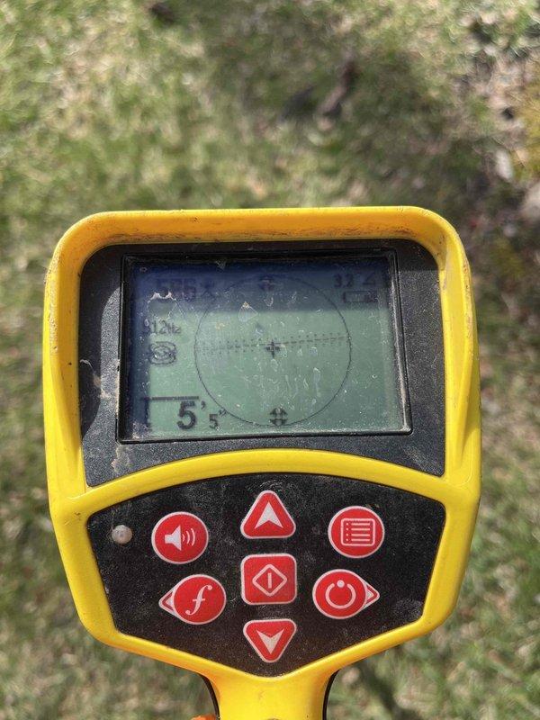 Returned to complete previously sold dig job (iDig #2606904401-000) and utilized electronic detection equipment to locate underground utilities prior to excavation. Prepared site by clearing debris from work area and exposing soil for inspection, with inspector scheduled same-day for verification of completed work.