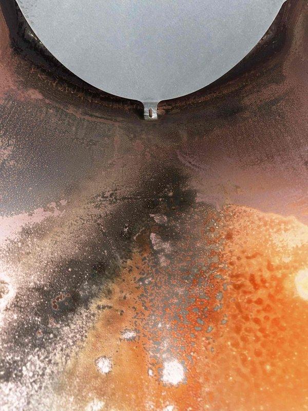 Inspected heat exchanger showing severe corrosion and rust damage consistent with age 10+ years, identified as source of system shutdown issues. Performed manual restart and tested ignition sequence to verify operation. Recommended replacement of heat exchanger due to safety concerns and repeated failure pattern over past two weeks.