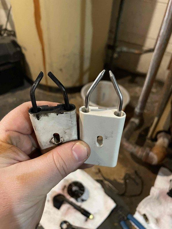 Performed scheduled maintenance service and replaced worn ignition electrodes on furnace. Removed old sooty electrodes with damaged ceramic housing and installed new OEM replacement components. System tested and verified proper ignition sequence after 4-hour service call.