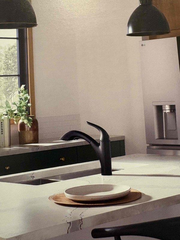 Conducted diagnostic assessment of reported kitchen sink drainage issue in six-year-old residence. Performed water quality testing using sample collection method to identify potential chemical composition affecting plumbing system. Inspected sink fixture, drain assembly, and under-sink plumbing components; resolved clog through appropriate intervention techniques to restore proper drainage functionality.