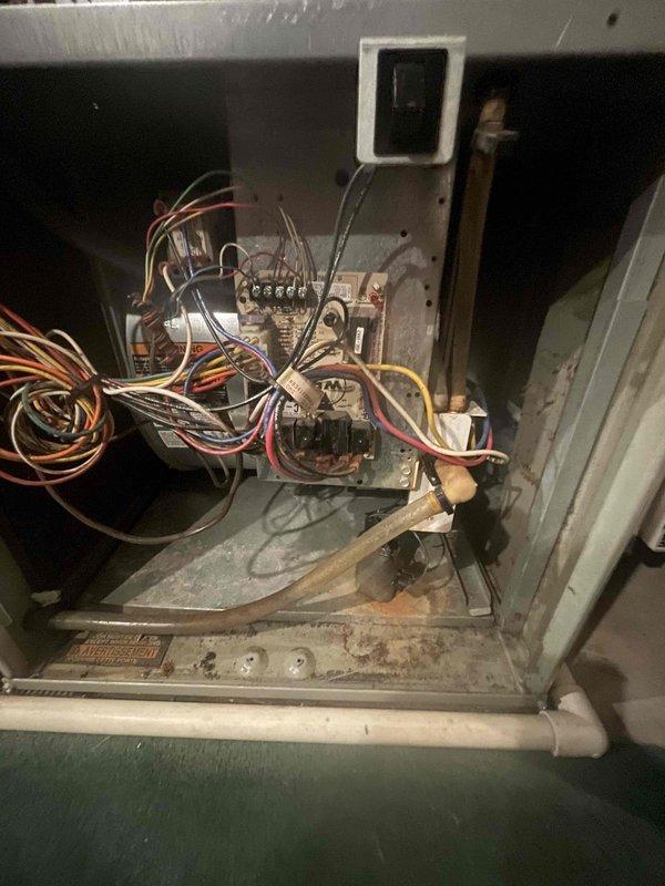 Performed scheduled heat maintenance on two units. Inspected interior components including circuit board, wiring connections, and copper lines for proper operation. Verified thermostat functionality, confirming heat mode operation with current temperature reading 66°F and set point at 65°F.