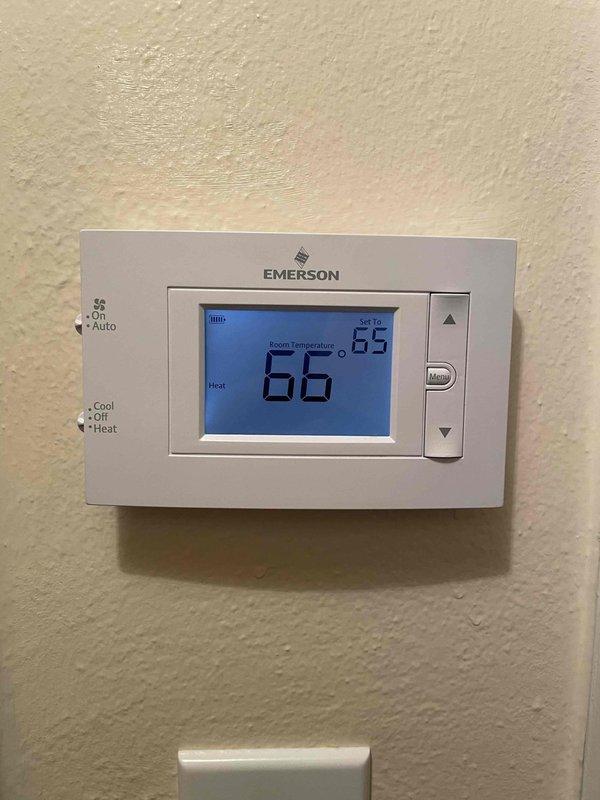 Performed scheduled heat maintenance on two units. Inspected interior components including circuit board, wiring connections, and copper lines for proper operation. Verified thermostat functionality, confirming heat mode operation with current temperature reading 66°F and set point at 65°F.