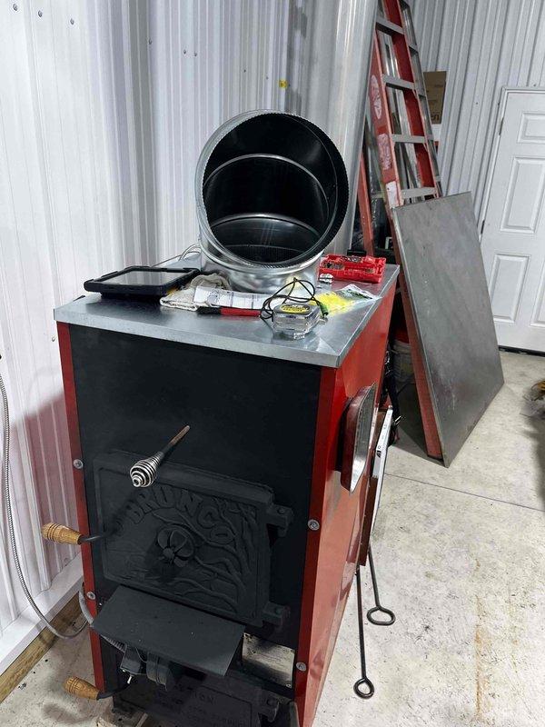 Successfully installed and connected thermostat to wood furnace located in barn structure. Completed electrical wiring from control box to thermostat, ensuring proper functionality for automated temperature control. System tested and confirmed operational.