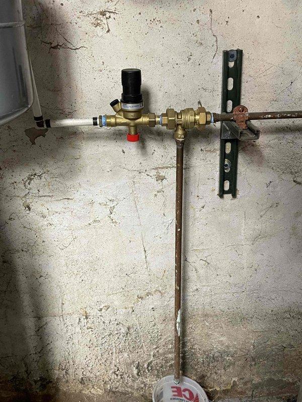 Responded to no-heat service call for Slant/Fin hot water boiler that was not providing heat or hot water. Upon inspection, discovered basement door was open causing system malfunction. Checked system diagnostics with temperature reading at 173° and pressure gauge operating within normal range, then closed door and restored normal operation of boiler for both heating and hot water functions.