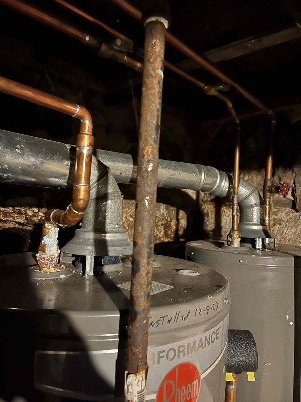 Successfully replaced failed 50-gallon gas water heater with new 40-gallon Rheem unit. Completed proper installation of all copper supply lines, shut-off valve, and galvanized steel vent pipe with appropriate connections. System tested and confirmed operational with no leaks.
