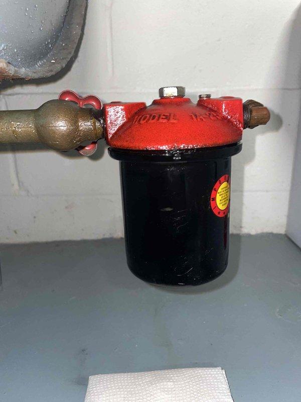 Diagnosed and serviced 7-year-old heat pump system that was not heating despite recent maintenance. Discovered contaminated fuel line requiring installation of new filter assembly with manual flow control valve. System now operating at optimal efficiency with clean fuel delivery.
