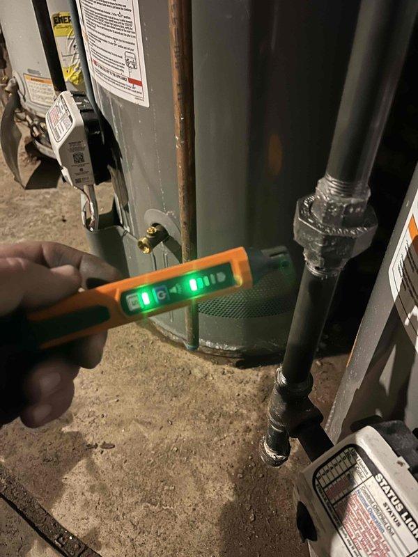 Performed gas leak detection and pressure testing on a three-unit Rheem Performance water heater system in mechanical room. Located and repaired leak at black pipe connection joint. Conducted follow-up pressure test with electronic testing device, confirming system integrity with all connections now properly sealed and operating within normal parameters.