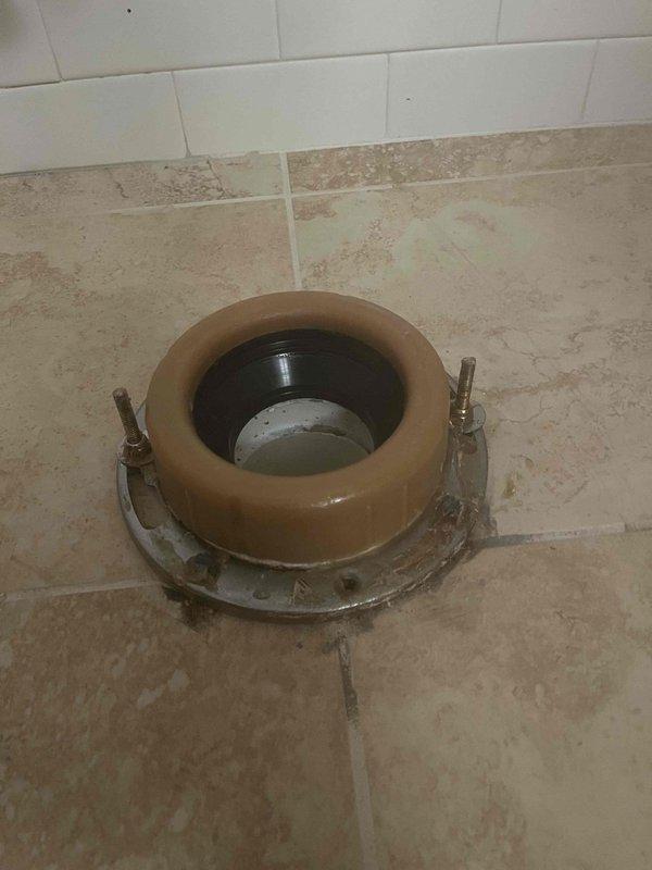 Responded to service call regarding strong odor from toilet. Inspected water supply line, shut-off valve, and toilet flange assembly. Discovered deteriorating wax ring causing sewer gas leak. Removed toilet, replaced wax ring, and reinstalled fixture with proper seal to eliminate odor issue.