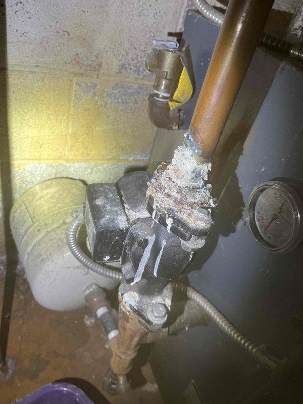 Responded to service call for main line blockage. Utilized power snake to clear significant mineral buildup and debris from drain pipe. Visual inspection revealed extensive corrosion in pipe interior with deteriorating walls and sediment accumulation, which was successfully removed to restore proper drainage function.