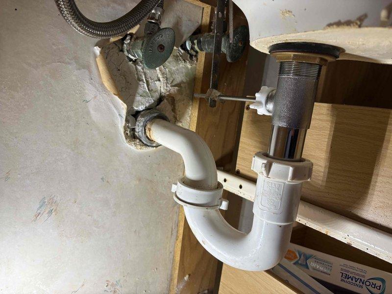 Successfully retrieved and returned a ring that had fallen into the kitchen sink drain by disassembling the P-trap assembly under the sink. Inspected all plumbing components after reassembly to ensure proper function and verify no leaks were present.