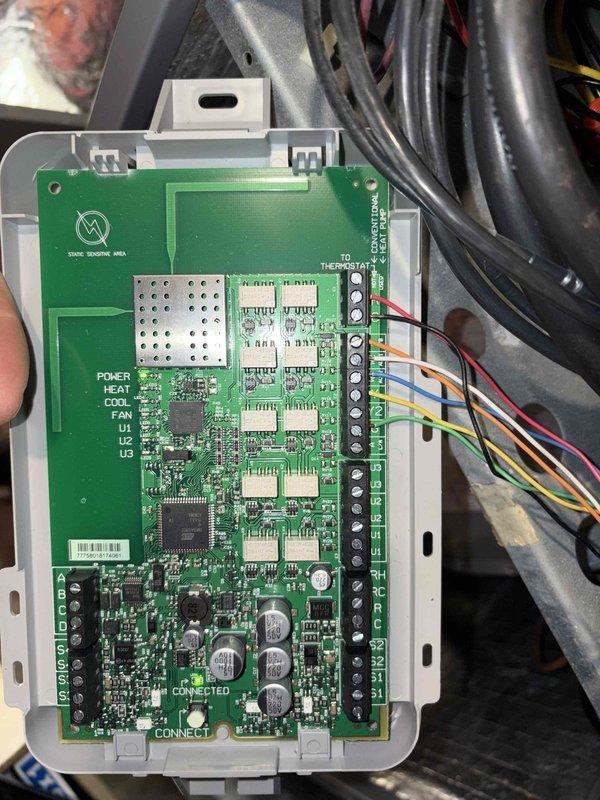 Performed heat pump maintenance service and inspected thermostat wiring for potential smart thermostat installation. Examined control board connections and existing wiring in ceiling/floor joist area, noting proper wire colors present for thermostat upgrade. Discussed maintenance plan options with customer who expressed interest in enrollment.