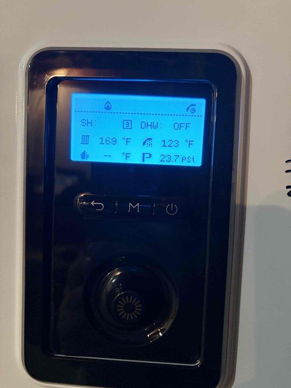 Responded to service call for non-operational boiler system. Performed level verification of unit installation and inspected digital control panel, which displayed normal operating parameters (SH: 3, DHW: OFF, temperatures at 169°F/123°F, system pressure at 237 psi). Confirmed proper functionality - no further repairs required.
