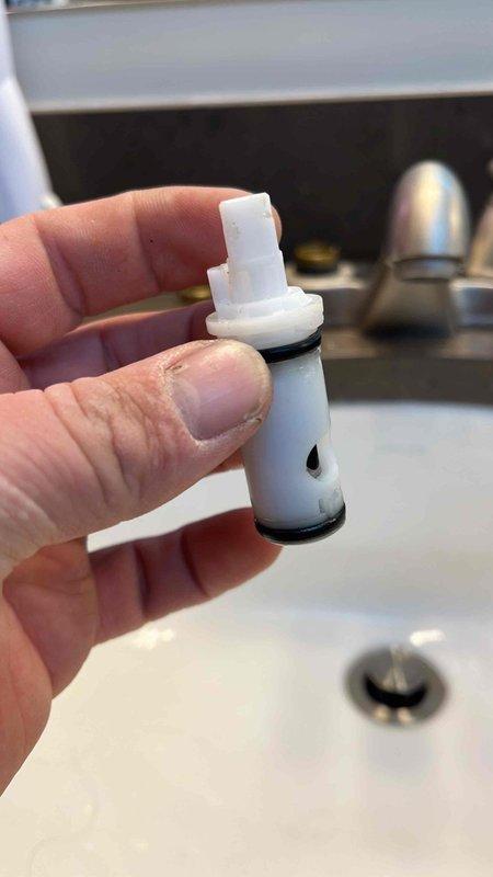 Diagnosed and repaired leaking master bathroom sink by replacing faulty valve stem. Removed old valve cartridge that showed worn o-ring, installed new component, and verified proper operation with no further leaks.