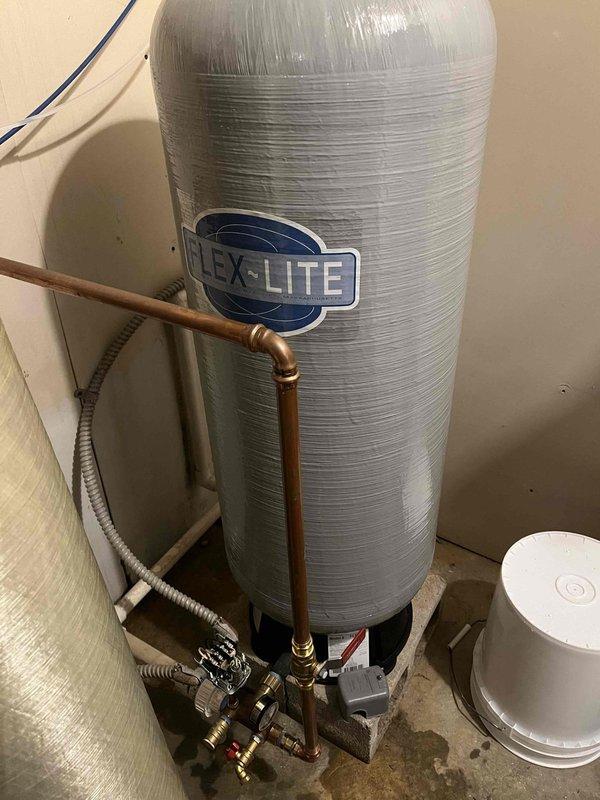 Successfully replaced pressure tank with appropriate T-fittings and installed eight new 1/4 turn shut-off valves throughout the system. Additionally installed customer-supplied faucet and drop-in sink, ensuring proper connection with new P-trap assembly and verified leak-free operation of all components.