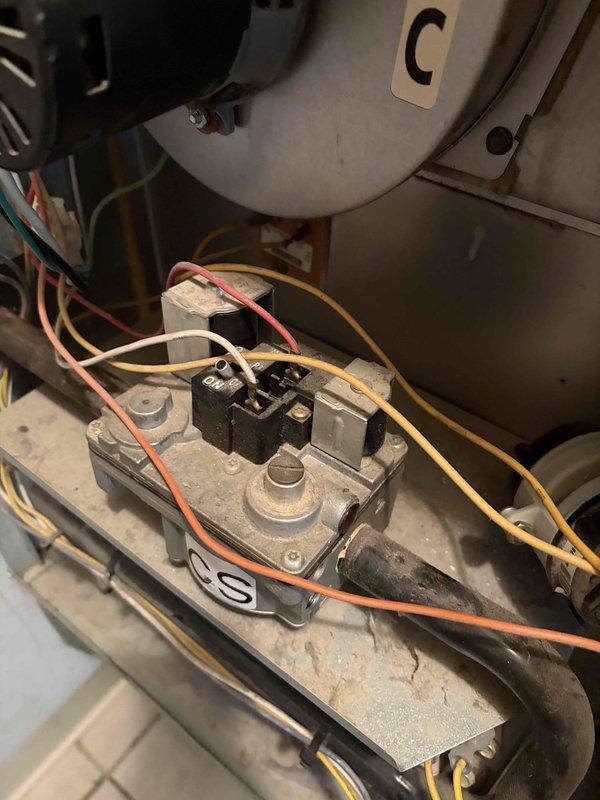Performed diagnostic service on 26-year-old Trane XE80 furnace with reported ignition failure issues. Inspected igniter assembly which showed significant wear and required replacement. System now functioning properly with restored reliable ignition sequence.