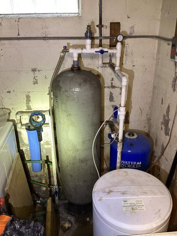 Conducted a site visit to assess the water treatment system in the utility room. Inspected the setup which includes a water softener tank, pressure tank, brine tank, and filtration components. Provided customer with comprehensive education on proper water treatment system operation and maintenance instead of proceeding with the originally planned drain snaking and camera inspection services.