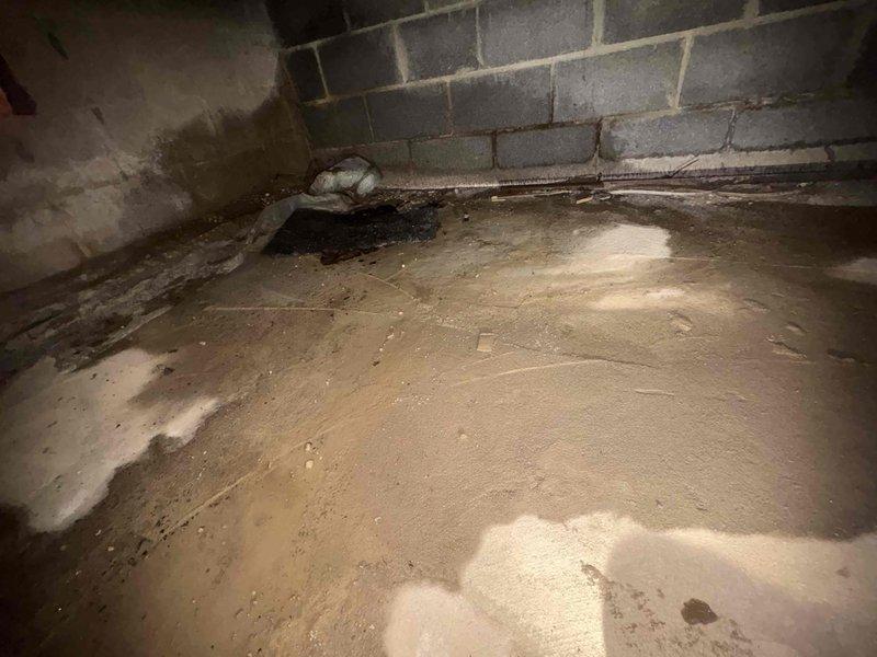 # Service Report: Plumbing Service - Clogged Drain/Sink

Responded to drainage issue in garage of 70-year-old residential property. Upon arrival, conducted comprehensive assessment of plumbing system including the reported drain problem and secondary toilet concern. Accessed crawl space beneath structure to inspect drainage lines and plumbing infrastructure. Inspection revealed aging plumbing system consistent with home's age, with evidence of moisture accumulation on vapor barrier in crawl space. Examined PVC drainage pipes, foundation plumbing penetrations, and overall condition of accessible plumbing components. Additionally evaluated toilet fill valve mechanism which was not achieving proper water level after flush cycle. Documented conditions via photographs for service records. Provided recommendations for addressing identified issues to restore proper drainage function and toilet operation.