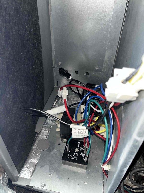 # HVAC Service - Sold Repair Summary

Returned to property to complete installation of previously sold fan control and time delay relay. Successfully installed black relay module with proper wire terminations to white plastic connectors inside equipment panel. Verified all electrical connections were secure, including red, blue, black, yellow, and green wire leads. Tested relay operation and confirmed proper fan cycling with time delay function working as designed. Unit operating normally upon completion.