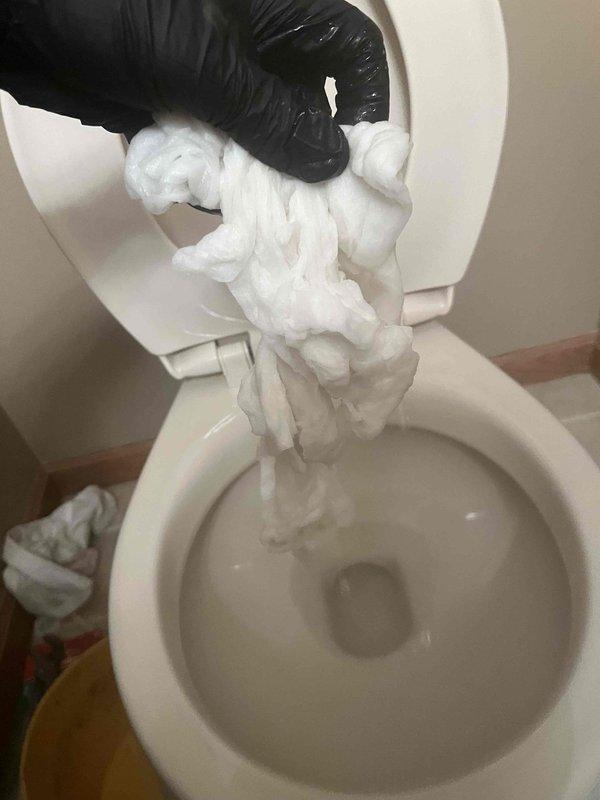 Responded to a backup issue affecting the downstairs toilet. Upon inspection, discovered insulation material obstructing the toilet bowl, which was successfully extracted and removed. Additionally, addressed a malfunctioning flush chain mechanism inside the toilet tank to restore proper operation.