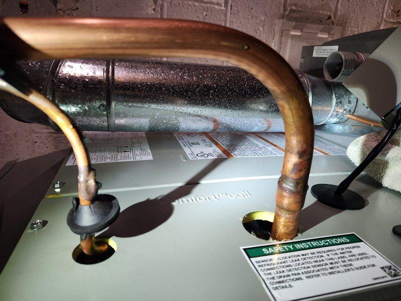 Completed installation of new air conditioning system and evaporator coil at residential property. Installed outdoor condensing unit with proper refrigerant line connections, electrical disconnect box, and condensate drainage system, ensuring all components were securely mounted to exterior wall and properly insulated. Interior evaporator coil was installed and connected to existing ductwork with copper refrigerant lines, system was pressure tested, evacuated, and charged to manufacturer specifications, and all electrical connections were verified for safe operation.