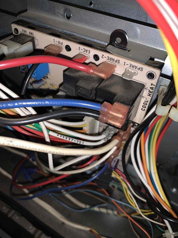 Returned to complete sold repair work on HVAC system. Performed electrical diagnostics using clamp meter to verify proper amperage readings and system operation. Connected and terminated multiple control wiring circuits at terminal block, including spare circuits, EAC, and ISM control wiring to ensure proper system functionality and communication between components.