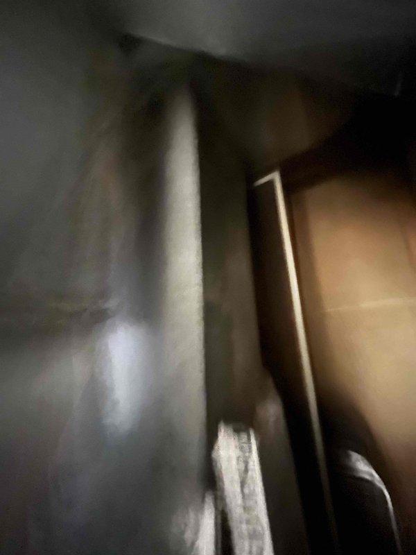 Completed HVAC system evaluation for 18-year-old furnace with non-operational blower motor and draft inducer issues. Existing air conditioning system assessed and determined to be in satisfactory working condition. Documented equipment condition and mechanical room configuration, including air handler unit, refrigerant line routing, and ceiling-mounted HVAC components. Provided replacement estimate for furnace system while confirming AC unit does not require replacement at this time.
