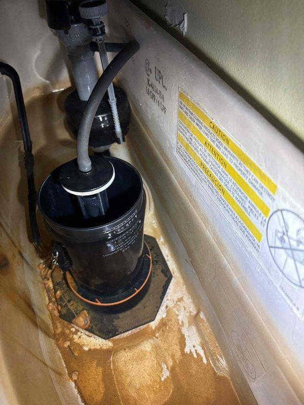 Responded to service call for suspected water leak investigation following abnormally high water consumption on recent utility bills. Conducted comprehensive leak detection inspection of the property's plumbing system and water supply infrastructure. Performed visual inspection of the water meter assembly located in the underground meter pit, checking for continuous meter movement indicating active water flow when all fixtures were off. Examined meter housing, brass fittings, and supply lines for signs of leakage, corrosion, or moisture accumulation. Inspected HVAC system condensate drain pan and surrounding areas for evidence of water intrusion or drainage issues that could contribute to water waste. Documented conditions of all inspected components with photographic evidence showing existing rust staining on equipment base and advanced corrosion on meter pit components. No active leaks detected during inspection period. Advised customer of findings and recommended continued monitorin