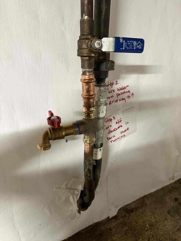 Responded to a frozen pipe concern at a cottage property that had been winterized. Upon inspection, assessed the main water supply plumbing assembly including brass ball valves, copper piping, compression fittings, and pressure relief components for freeze damage. Verified shut-off valve operation and examined all visible pipe sections and connections for cracks, splits, or signs of ice expansion damage. All plumbing fixtures and supply lines, including flexible braided hoses under cabinetry, were inspected for integrity and proper function.