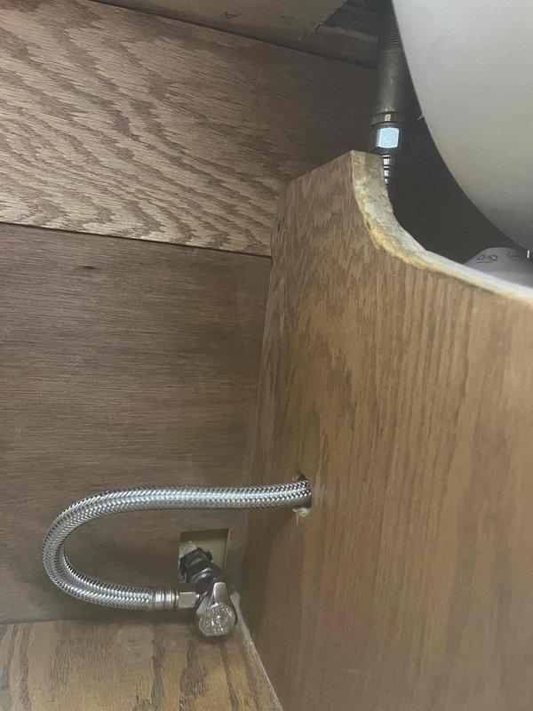 Responded to a frozen pipe concern at a cottage property that had been winterized. Upon inspection, assessed the main water supply plumbing assembly including brass ball valves, copper piping, compression fittings, and pressure relief components for freeze damage. Verified shut-off valve operation and examined all visible pipe sections and connections for cracks, splits, or signs of ice expansion damage. All plumbing fixtures and supply lines, including flexible braided hoses under cabinetry, were inspected for integrity and proper function.