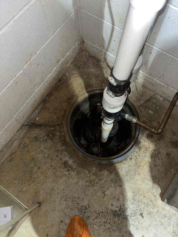 Replaced water-driven sump pump system with battery backup unit in basement utility area. Removed existing discharge piping and installed new PVC discharge line with proper securing to wall. System tested and verified operational with backup power capability to ensure continued protection against basement flooding during power outages.