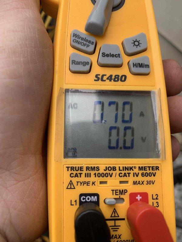 Completed cooling maintenance club visit on air handler system. Inspected condensate drain assembly with QuickFil funnel and PVC piping configuration, verifying proper drainage function and checking for blockages or leaks. Performed electrical diagnostics using Fieldpiece SC480 multimeter, measuring amperage draw at 0.70A and voltage readings to verify system performance within manufacturer specifications. All components operating normally with no issues identified during inspection.