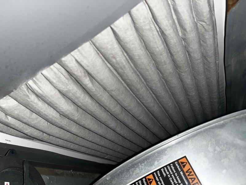 Completed cooling maintenance club visit on air handler system. Performed comprehensive inspection of HVAC components including ductwork, refrigerant lines, compressor unit, and blower motor assembly. Documented system condition with detailed photographs showing flexible ductwork installation in confined space and internal mechanical components. Noted copper refrigerant line elbow joint exhibiting rust and corrosion at 90-degree connection point requiring monitoring. Verified compressor unit wiring connections and terminals in proper condition. Inspected blower motor assembly and mounting hardware. Checked refrigerant line insulation and securing brackets. All maintenance tasks completed per club membership agreement specifications.