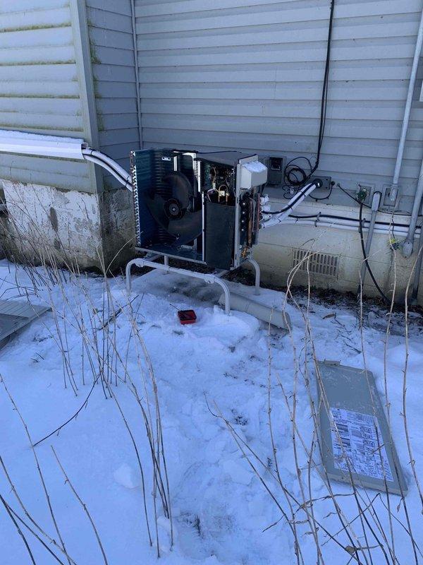 Returned to site with two technicians for comprehensive leak search on 4-head mini-split system under warranty conditions. System was previously charged with nitrogen and refrigerant mixture for leak detection purposes. Utilized digital manifold gauges to monitor system pressures and temperatures while conducting thorough inspection of outdoor unit, refrigerant line connections, and all four indoor head units. Performed methodical leak search procedures on all accessible components including line sets, service ports, and mechanical connections during favorable ambient conditions above 32°F, which allowed for proper refrigerant behavior and accurate leak detection.
